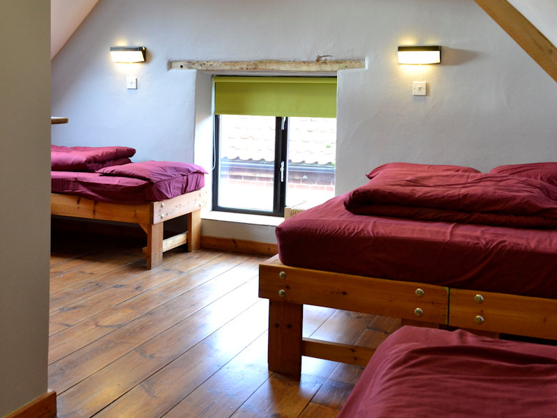 Family Quad Room, double bed and two single beds, with an ensuite shower room - Deepdale Camping & Rooms