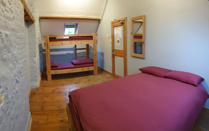 Quad room with double bed and bunk beds in Deepdale Granary - Self catering group accommodation for up to 16 people on the beautiful North Norfolk Coast
